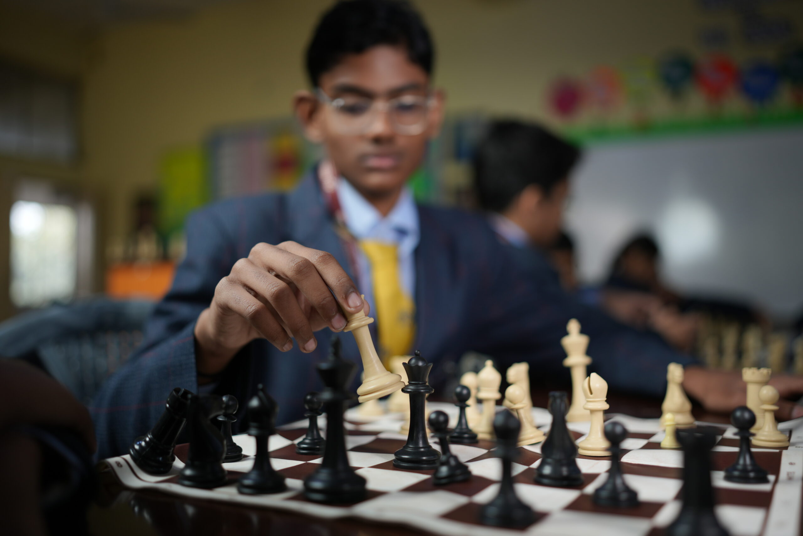 Students playing chess at Modern School