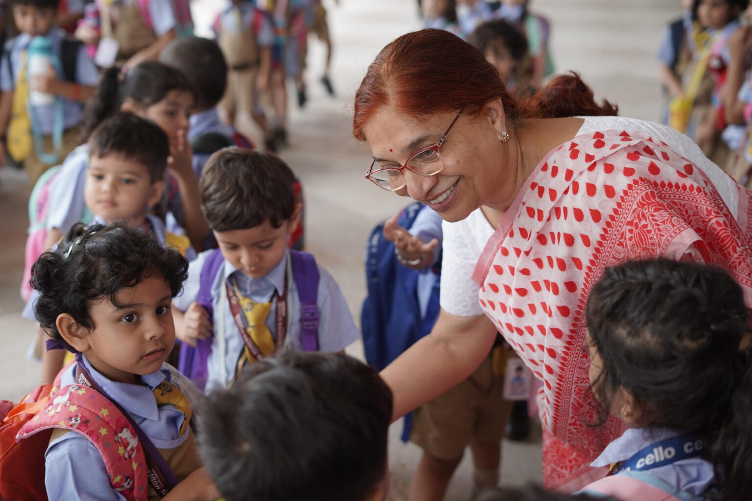 Principal Meena Kane with primary students