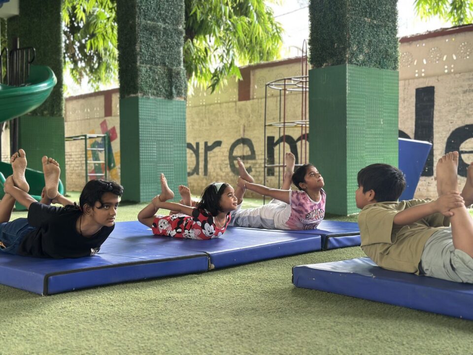 Children doing calisthenics on mats