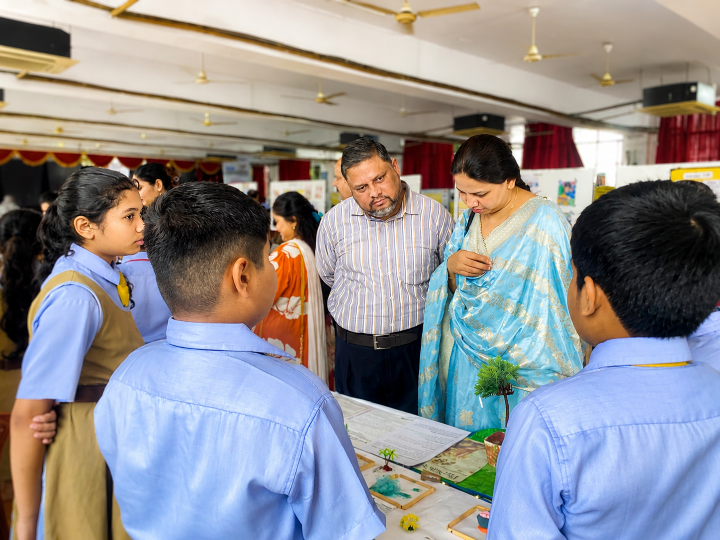 Parents and visitors viewing student projects at the 40th Cognito