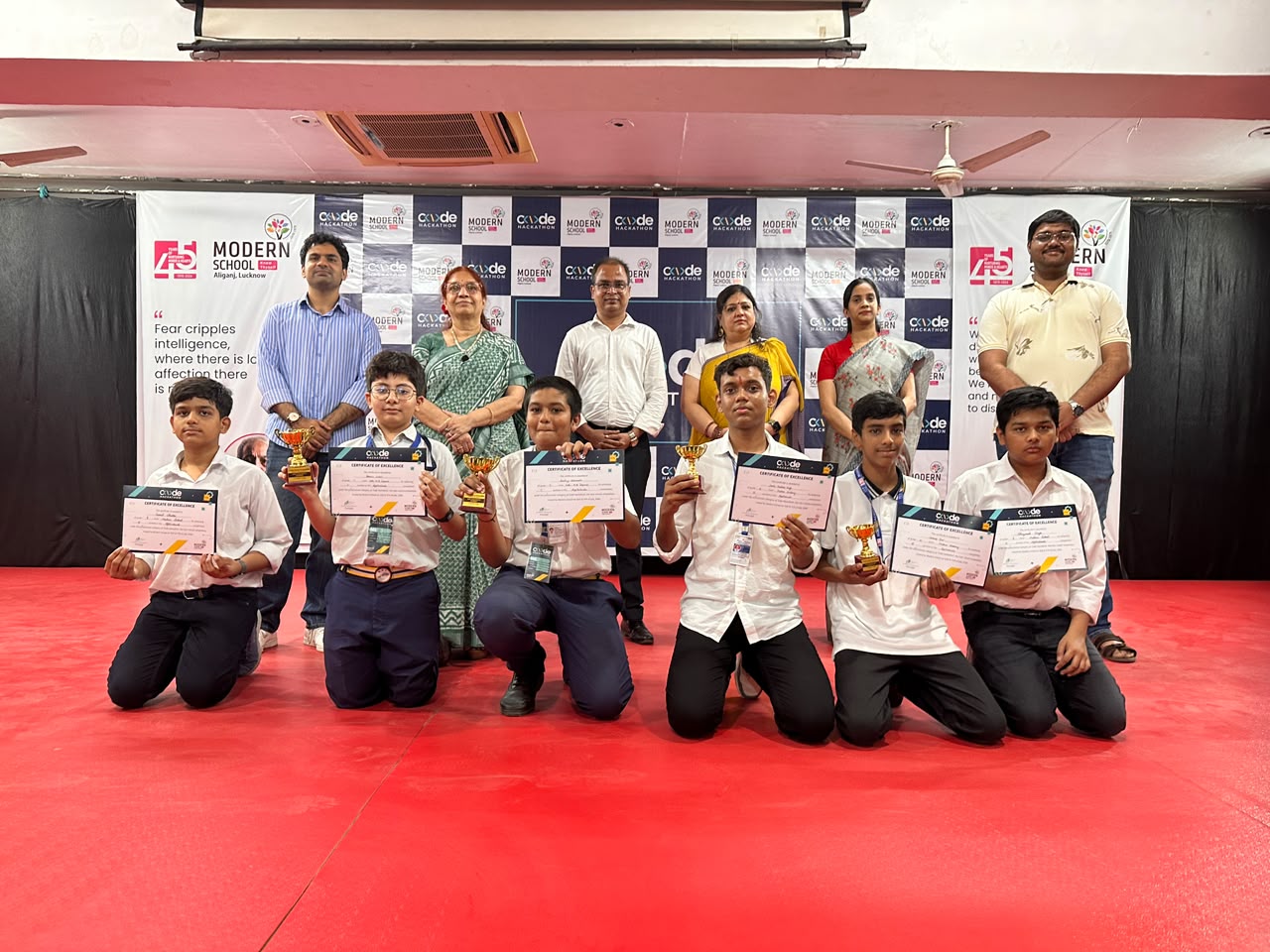Prize winners with judges and school staff at Code Hackathon 2026